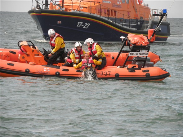Photo:Dragging local crew member to safety