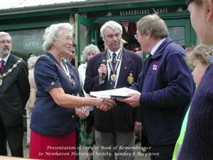 Photo:Mayor of Newhaven Cllr Jo Lewry presents a copy of The Book of Remembrance to Mike Tubbs, Chairman of Newhaven Historical Society