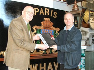 Photo:Andy Gilbert presents the book to Museum curator Peter Bailey.