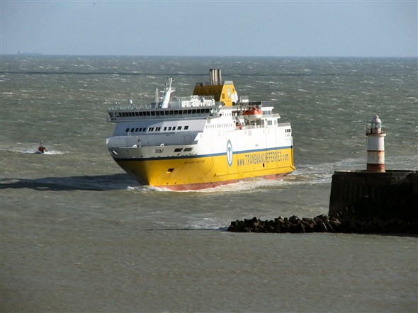 Photo:Rounding the breakwater. The little pilot boat sensibly stayed in the lee of Seven Sisters on the way in.
