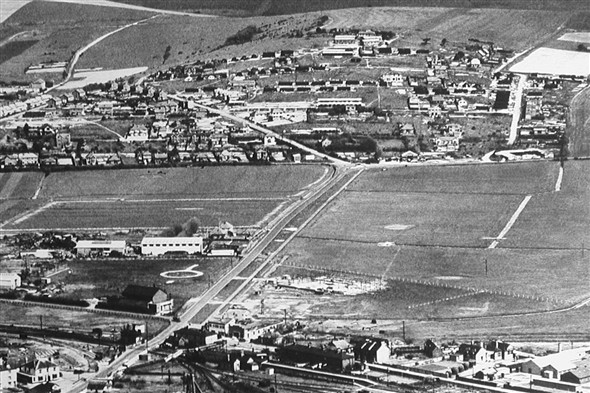 Photo:Diagonal aerial view of Mount Pleasant c.1950 showing the Nissen huts and some of the remaining communal huts (Ablutions, Mess huts, & N.A.A.F.I.) huts, a few of which have already been demolished at the NW end of Arundel Road by the time of this photograph. Many of the chalk footpaths between the huts are still prominent.