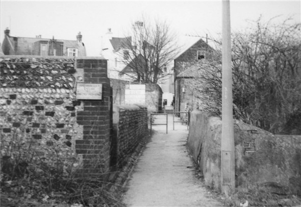 Photo:Into South Lane Sidney Cottage is now demolished behind the flint wall, the High Street is straight ahead - c1970