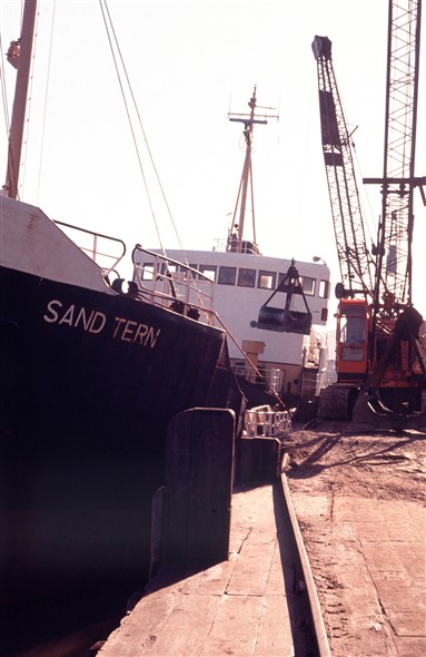 Photo:Sand Tern at the West Quay. She was a small dredger of 561 gross tons and sent to the breaker's yard in 1998.