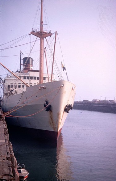 Photo:A handsome ship built 1949 and scrapped in 1971. Note the tiny pilot boat alongside the quay used around 1970!
