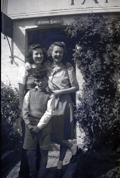 Photo:Marcia Stapley & Edwin Warnes. I thought the 3rd person was Marcia & Edwin's sister, Honor, but she says it's not her. Rose Cottage Inn, Alciston, late 1940s