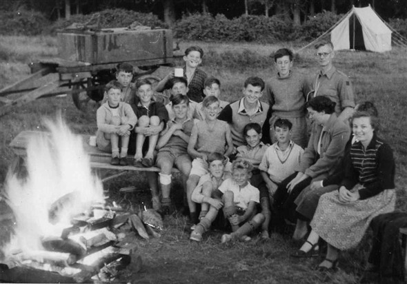Photo:Camping at Ringmer. Left to right back row: David Penfold, Tom Ince, Adrian Hunkin, Eric Hunkin.  Sitting second row: Alan Wilson, Colin Holden, Brian Comben, Colin Smith, Jim Ince. Sitting third row: Micheal Poll, ? Jones, David Hedges, ?. The two girls I cannot remember, one was Jim`s sister and the other his girlfriend, I think. Sitting on the ground: ?, and Dieter Lewery.