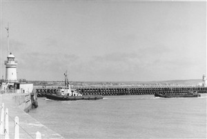 Photo:Another view of barge towing - note the West Pier lighthouse is still there and the concrete walls are still in good condition.